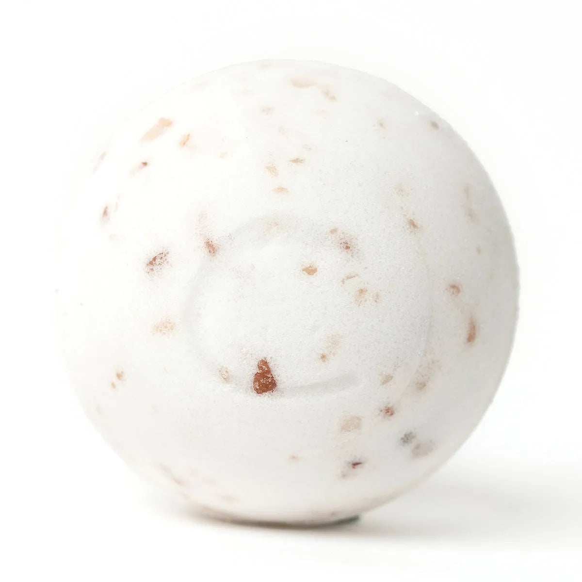 Round white bath bomb speckled with pink Himalayan salt crystals on a clean white background.