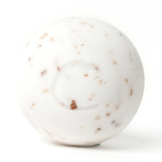 Round white bath bomb speckled with pink Himalayan salt crystals on a clean white background.